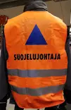 Huomioliivi Suojelujohtaja oranssi VSS - Muut VSS tarvikkeet - 2058 - 2